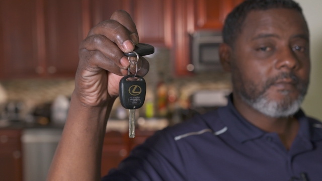 Jerome Davis holds the keys to his car that was impounded by the city of Chicago