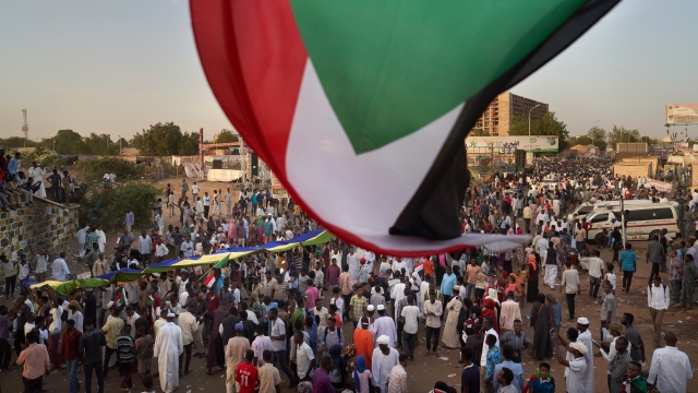 Flag waves over protesters in Sudan