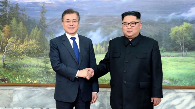 South Korean President Moon Jae-in shaking hands with North Korean leader Kim Jong-un