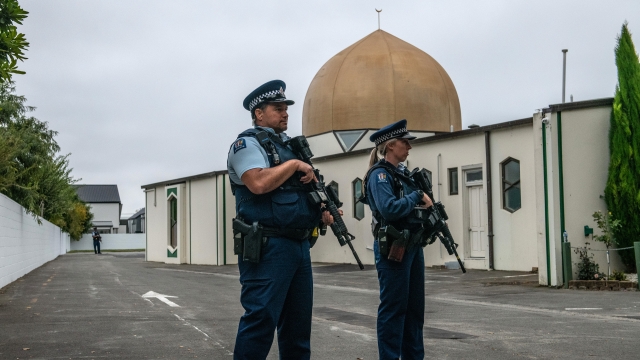 Police officers stand guard outside the Al Noor mosque in Christchurch, New Zealand