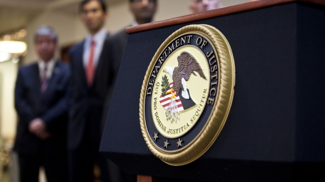The Department of Justice seal on a podium