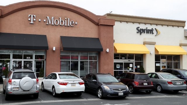 T-Mobile and Sprint store sit side-by-side in a strip mall