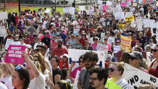 Protesters participate in a rally against one of the nation's most restrictive bans on abortions.