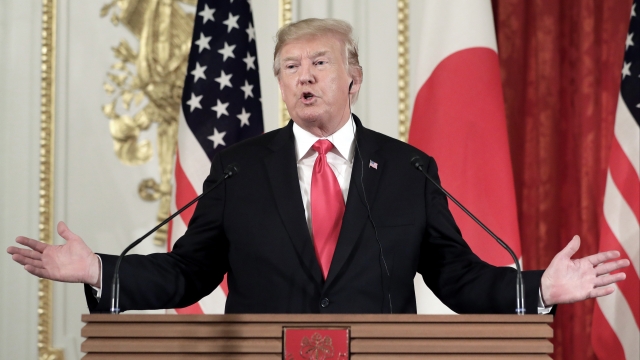 President Donald Trump speaks during a press conference in Japan
