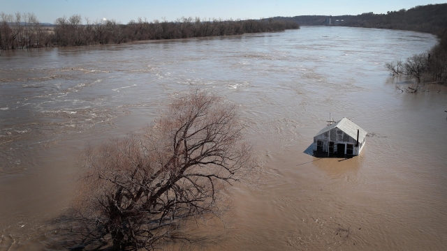 A house in Kansas surrounded by floodwater