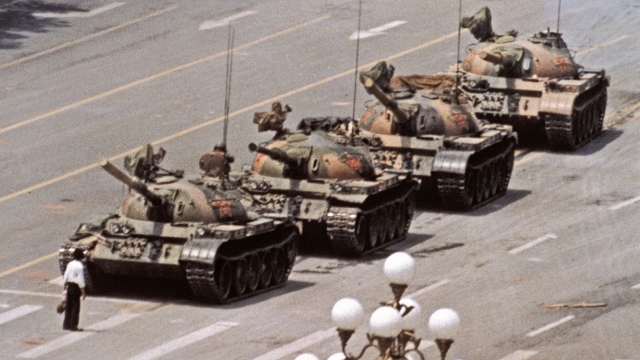 An unidentified man stood in front of tanks during the Tiananment Square Protests. He is known as 'Tank Man.'
