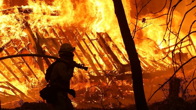 A firefighter battles a fire.