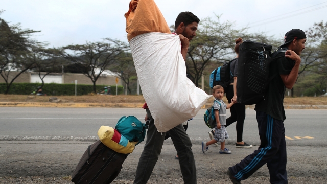 Migrants from Venezuela walk through neighboring Colombia. Migrants have to pass through Colombia on their way to Peru.