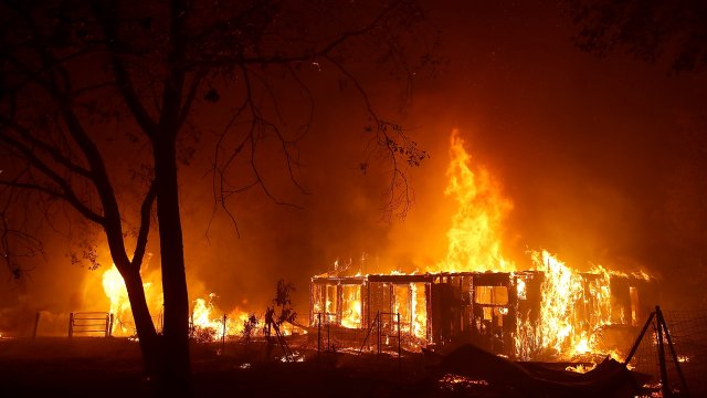 A home burns as the Camp Fire rages.