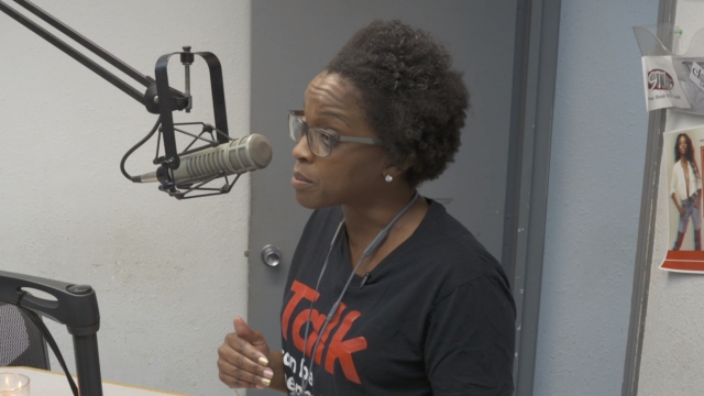 Deja Abdul-Haqq discussing HIV/AIDS on the radio in Jackson, Mississippi