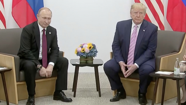 Russian President Vladimir Putin and President Donald Trump speak to the press in Japan