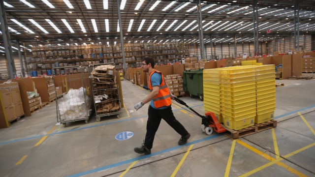 Amazon employee working in a fulfilment center.