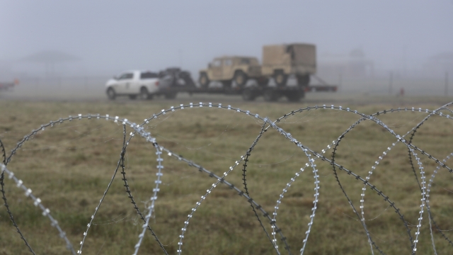 A truck moves U.S. Army vehicles near the U.S.-Mexico border