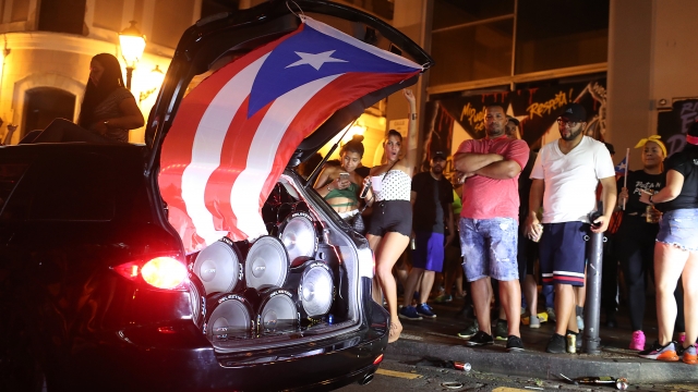 People line the streets as they celebrate that Ricardo Rossello, the Governor of Puerto Rico, is stepping down.
