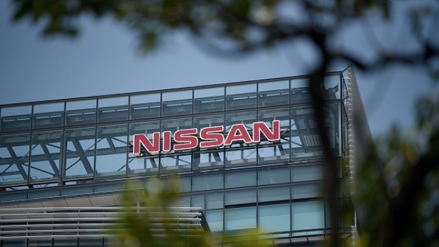 The word "Nissan" in red text on side of building