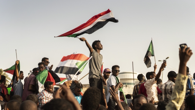 A man waves the Sudanese flag during a protest on April 27 in Khartoum Sudan.