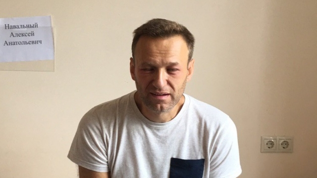 Russian opposition leader Alexei Navalny sits in a hospital room
