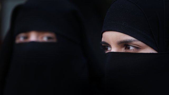 Two women wearing Islamic niqab veils.