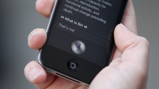 A man uses 'Siri' on an iPhone
