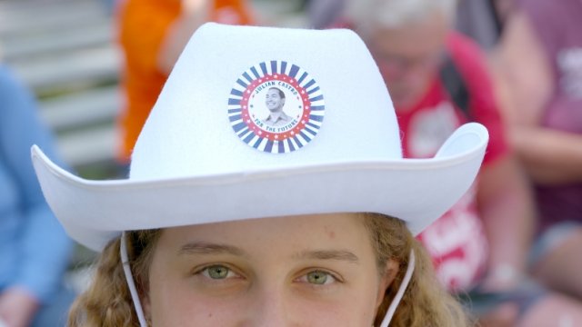 Iowa State Fair attendee wears a Julian Castro hat