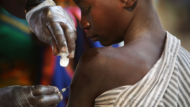 A boy is vaccinated against measles in Africa