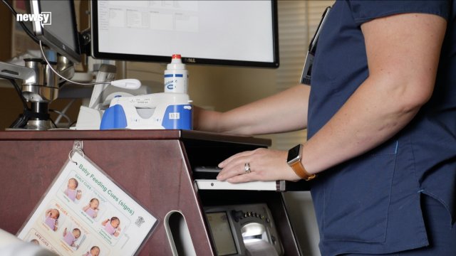 A Videoblocks image of a nurse preparing to work with a woman in labor