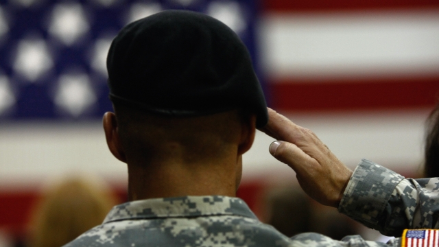 U.S. soldier salutes flag
