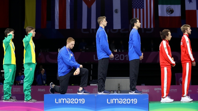 Team USA fencer Race Imboden kneels