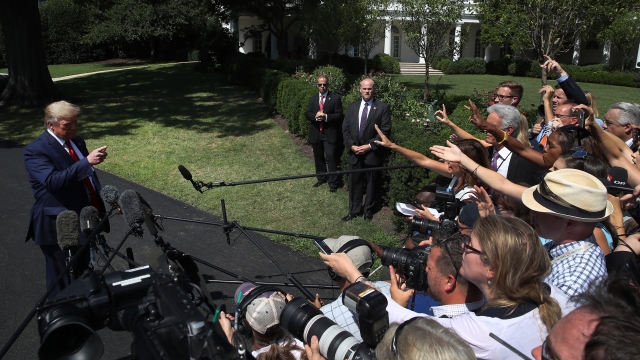 President Trump speaks with reporters.