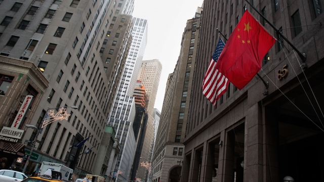 A Chinese flag flies next to a U.S. flag