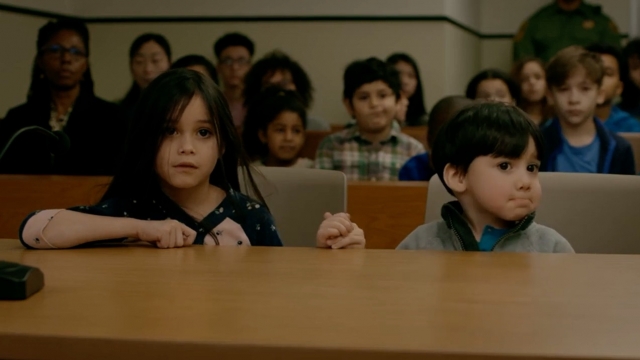 Two young children sitting through a court hearing in "Orange Is The New Black."