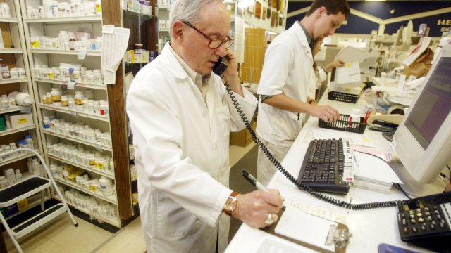Pharmacist takes a prescription drug order over the phone