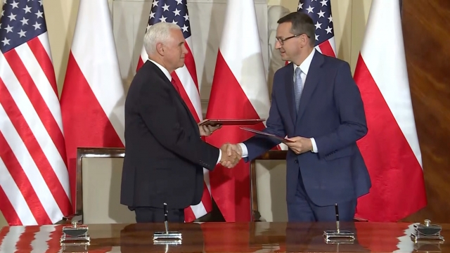 Vice President Mike Pence and Polish Prime Minister Mateusz Morawiecki shake hands.
