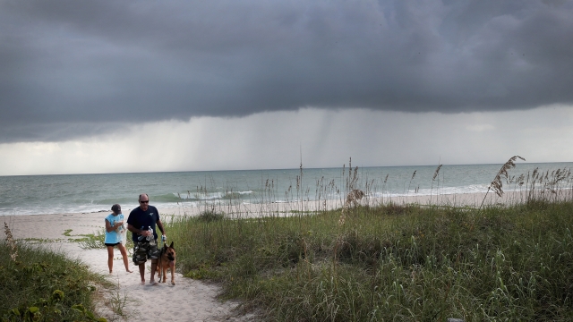 Rain clouds move toward shore as as Hurricane Dorian churns off the coast of Florida.