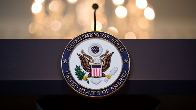 The State Department seal on the lecturn
