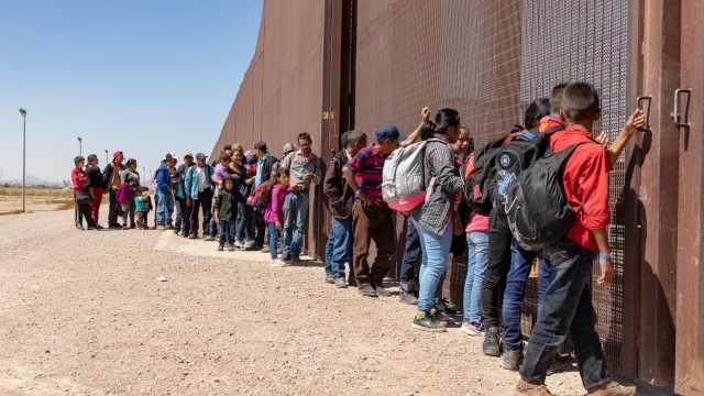 Migrants who crossed the border surrender near El Paso, TX