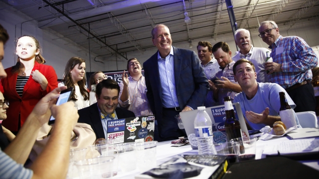 Dan Bishop, center, smiles as he gets up from the table after looking at election night party on September 10, 2019