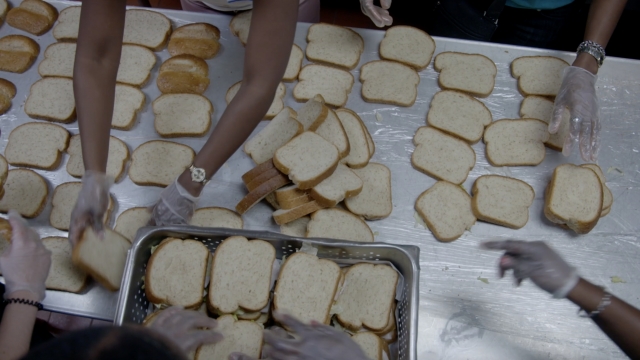 Volunteers prepare sandwiches