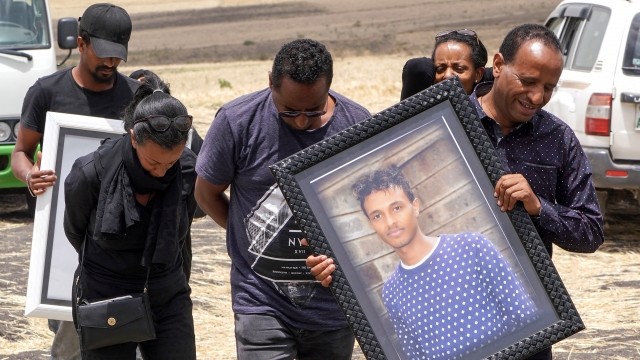 Family members of 28-year-old Captain Yared Getecho visit the crash site of Ethiopian Airlines Flight ET302
