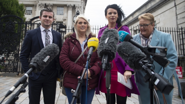 Sarah Ewart reacts outside Belfast High Court after the landmark ruling in her favor