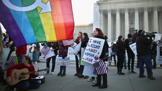 LGBTQ demonstrators protest outside the Supreme Court