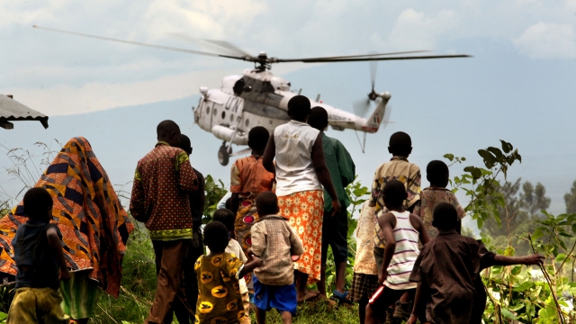 Helicopter for U.N. peacekeeping force lands at refugee camp in the Democratic Republic of the Congo.