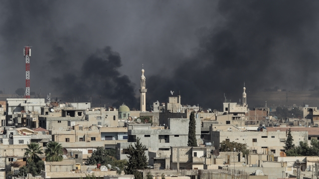 Smoke rises over a town on the Syria-Turkey border.