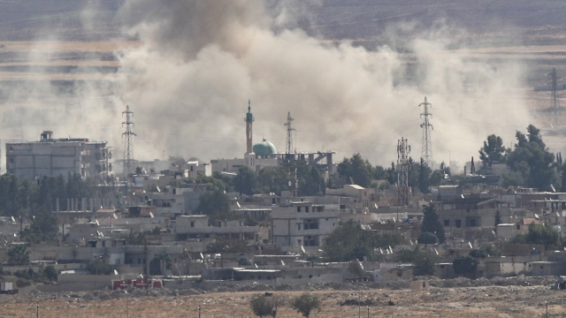 Smoke rises from Syrian town of Ras al-Ain amid Turkish offensive Oct. 15.