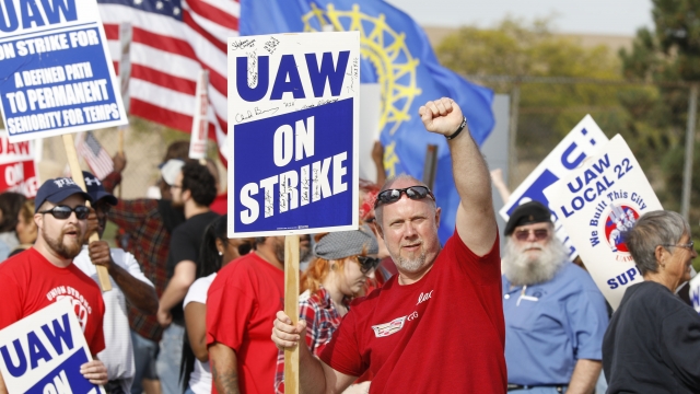 United Auto Workers members picket