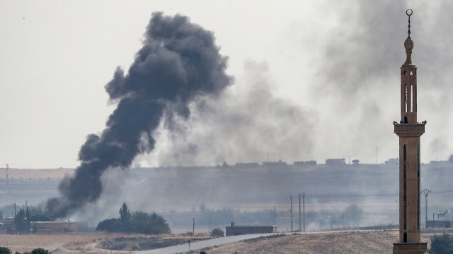Smoke rises from a Syrian town near the border of Turkey