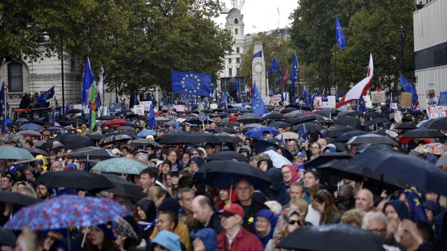 Protesters gather on Parliament Street in the rain during the "Together for the Final Say" march on October 19, 2019 in Lond