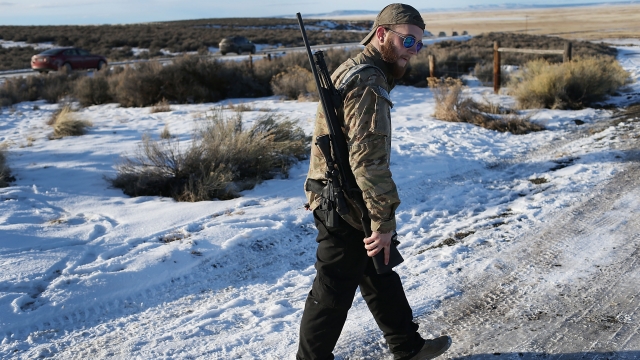 Anti-government militia member patrols Maheur National Wildlife Refuge in Oregon during 2016 occupation.