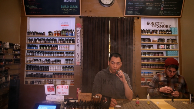 Smoke shop worker vaping