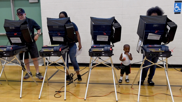 Voters cast their ballots at voting machines at Shadow Ridge High School on Election Day on November 8, 2016 in Las Vegas